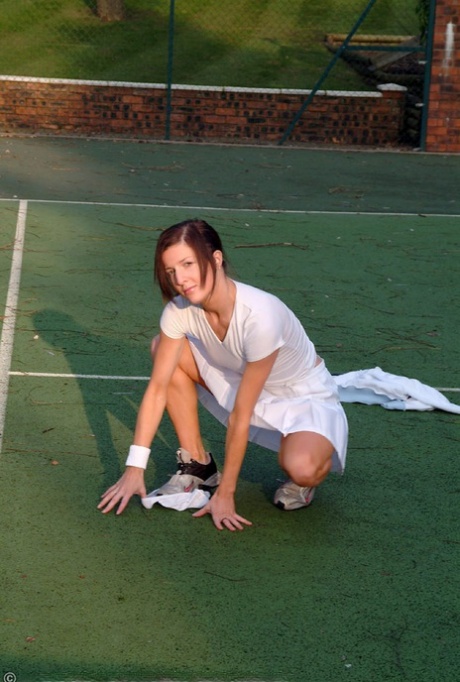 Hot British tennis player Olivia strips & masturbates on the court