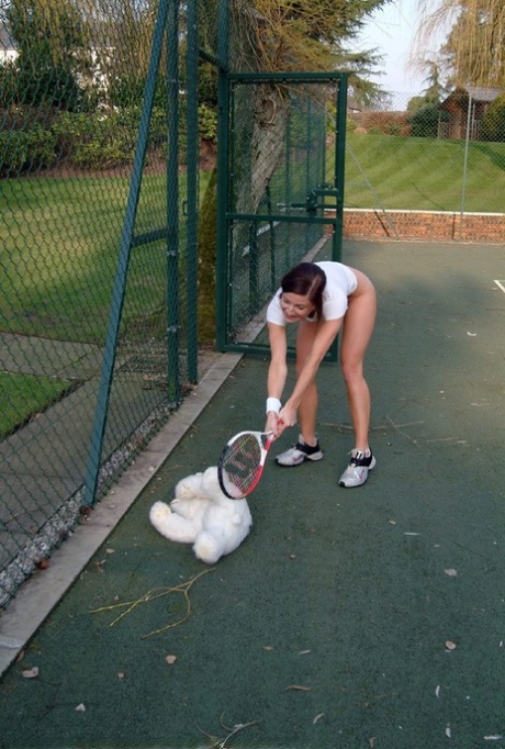Hot British tennis player Olivia strips & masturbates on the court